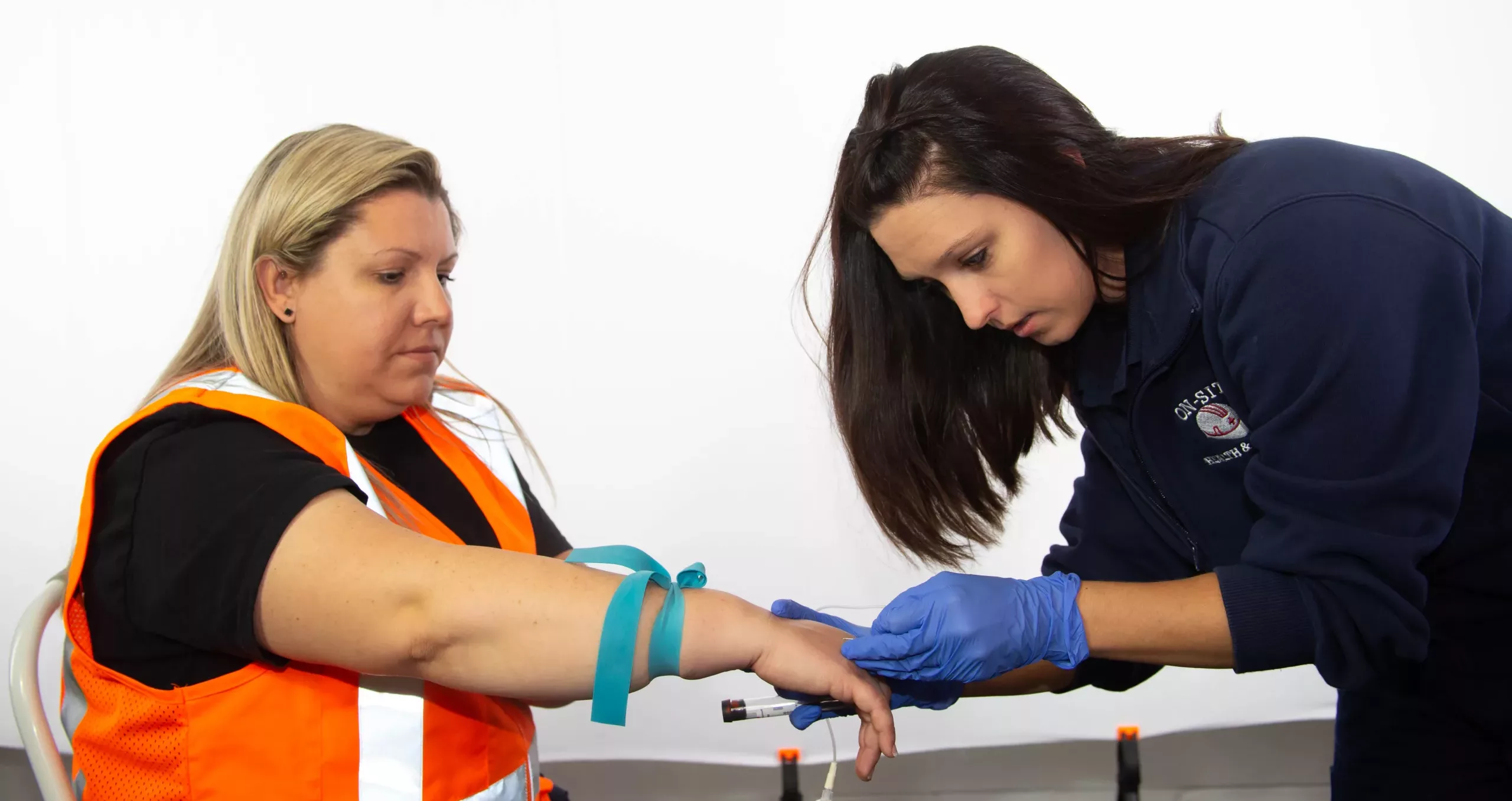 On-Site Nurse drawing blood for testing from a construction worker